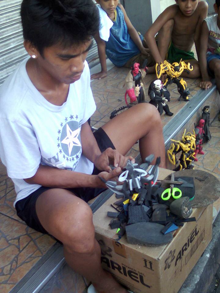 vendor creates action figures from rubber scraps of slippers